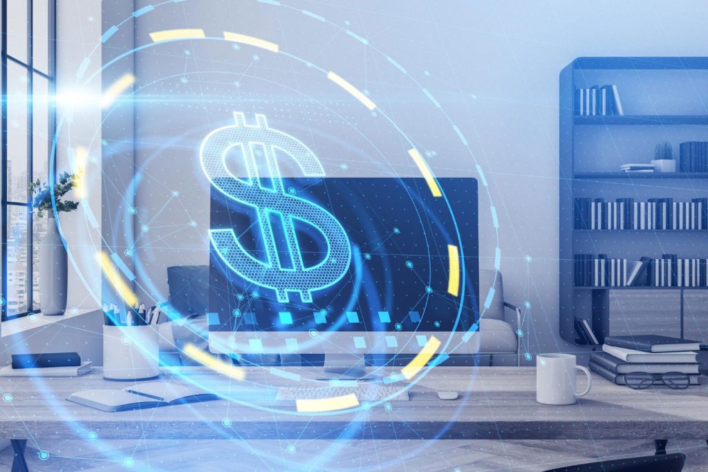 Escritório com mesa de computador com um símbolo digital de dinheiro sobre a imagem, representando quanto custa montar um provedor de internet.