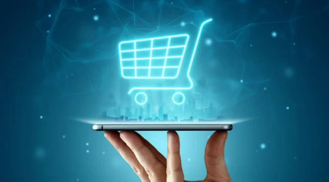 Holograma de carrinho de compras sobre um celular, representando como fazer seu site vender mais.